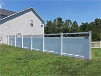 <b>6 foot high white vinyl privacy fence with black aluminum spindle topper</b>